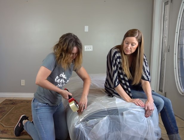 Covering a queen size mattress with painter’s plastic